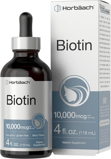 Biotin supplement liquid in a glass bottle with a dropper, labeled 10,000mcg, next to its packaging box.