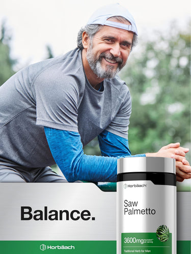View 6 Middle-aged man in athletic wear smiling, leaning next to a bottle of Horbäach Saw Palmetto.