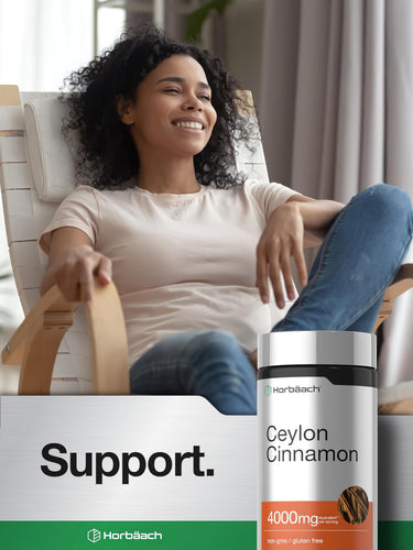 View 6 Young woman smiling in a chair with a Horbäach Ceylon Cinnamon bottle and 'Support' text nearby.