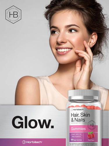View 6 Young woman smiling and touching her cheek beside a bottle of Horbaach Hair, Skin & Nails gummies.