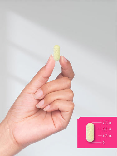 View 7 A caplet, held between fingers, measures 7/8 inch.