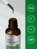 Bottle of Herb Bach Liquid Chlorophyll with a dropper and certification badges on a green and gray background