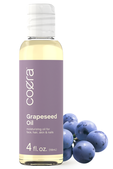 View 1 Coera Grapeseed Oil bottle with grapes on a white background