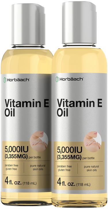 Two bottles of Horbaach Vitamin E Oil with visible labels and measurements.