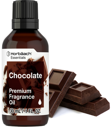 View 1 A bottle of Horbaach Essentials Chocolate Premium Fragrance Oil with a dropper, next to pieces of chocolate.