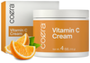 view 1 Coera Vitamin C Cream jar and packaging with oranges on a white background