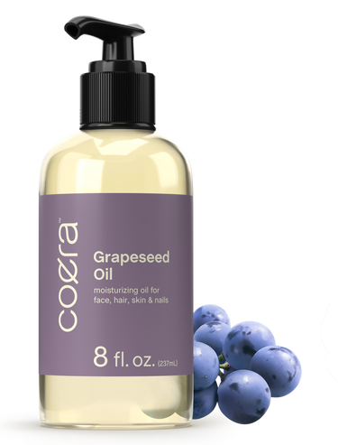 Cozera Grapeseed oil bottle with pump and grapes on a white background