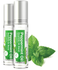 Two bottles of peppermint oil with green labels and mint leaves on a white background