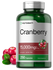 Supplement bottle labeled 'Cranberry' with cranberries on a white background