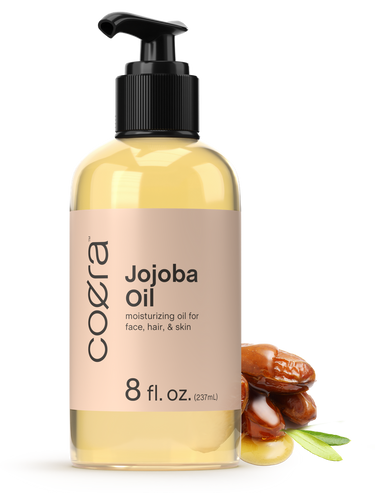 Coera Jojoba Oil bottle with pump on a white background
