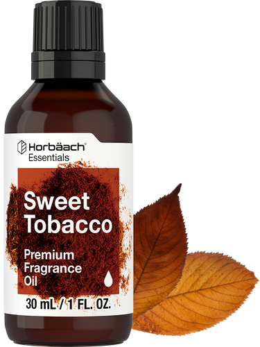 Bottle of Horbaach Sweet Tobacco fragrance oil with leaves on a white background