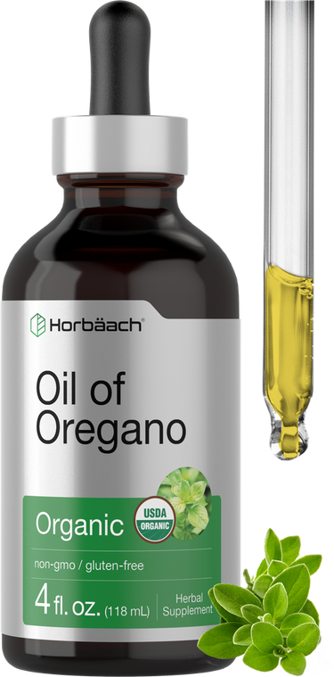 Bottle of Oil of Oregano with dropper and oregano leaves on a white background
