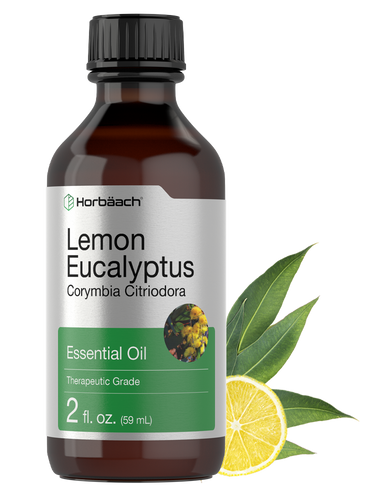 Bottle of Lemon Eucalyptus essential oil with a lemon and eucalyptus leaves on a white background