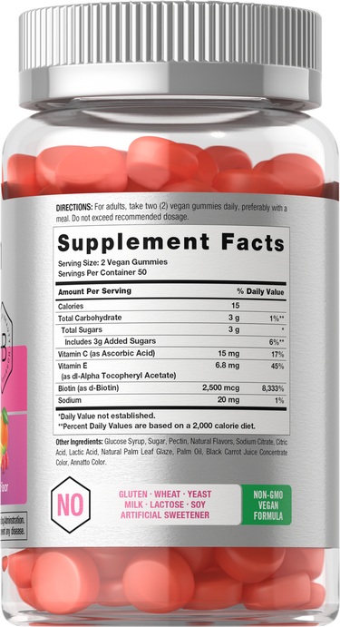 Supplement bottle with pink gummies and label details.