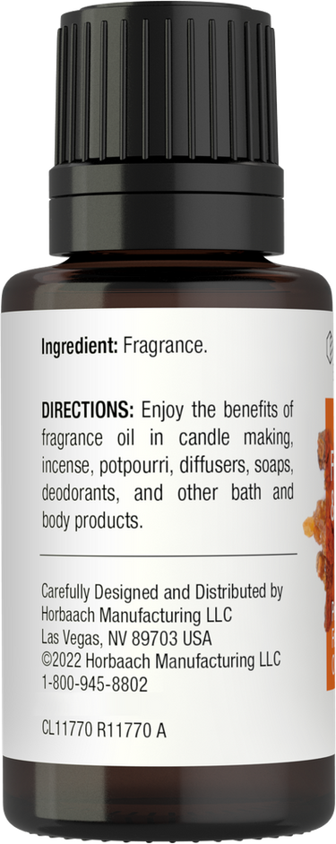 Bottle of fragrance oil with black cap and white label