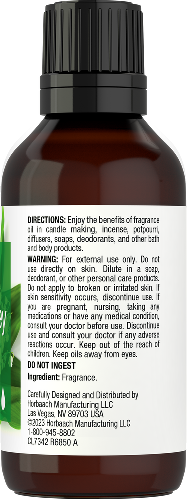 Bottle of fragrance with label and directions on a white background