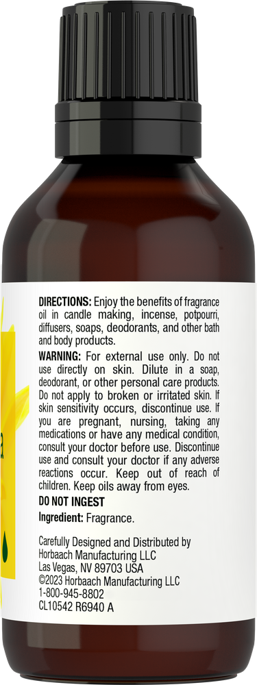 Brown bottle with black cap containing fragrance, label with directions and ingredients.