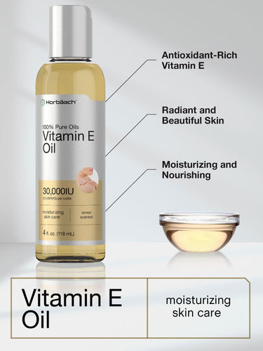 View 3 Bottle of vitamin E oil with text highlighting benefits and a small glass container of oil.