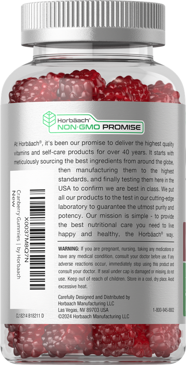 Bottle of vitamins with red capsules and label