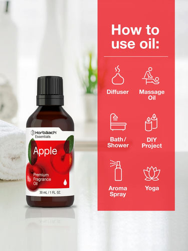 Bottle of apple fragrance oil with usage instructions on a red background