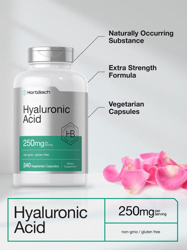 View 4 Bottle of hyaluronic acid capsules with pink flower petals on a light background.