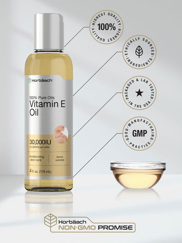 View 5 Bottle of vitamin E oil with certification badges on a white background