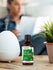 Bottle of Herbals Lily of the Valley fragrance oil on a table with a diffuser and plant in the background.
