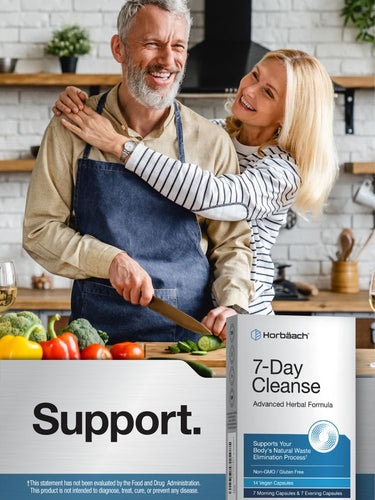 View 5 Senior man chopping vegetables, smiling blonde woman hugging him in a kitchen, with a Horbäach 7-Day Cleanse box nearby.