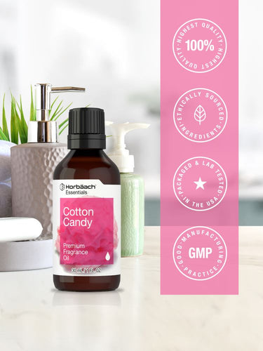 Bottle of fragrance oil with pink label on a white background with certification icons.