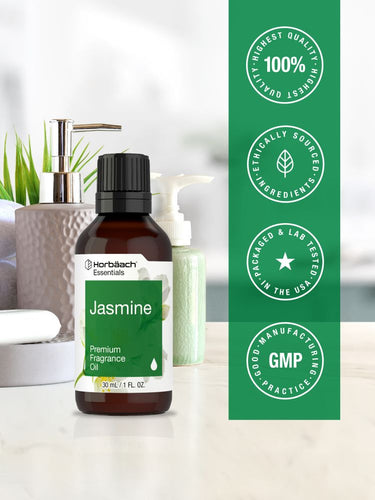 View 5 Jasmine premium fragrance oil bottle with Harlech Essentials branding on a blurred bathroom background