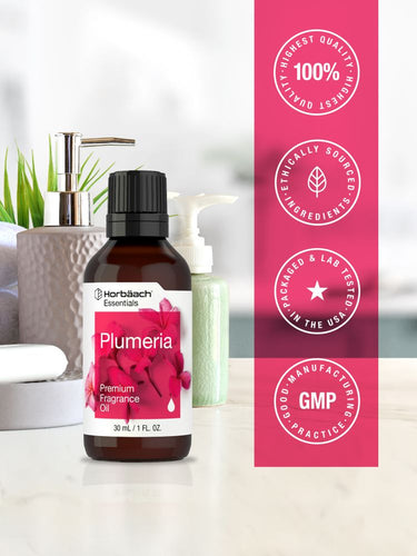 View 5 Bottle of Plumeria fragrance oil with pink and white label on a white background.