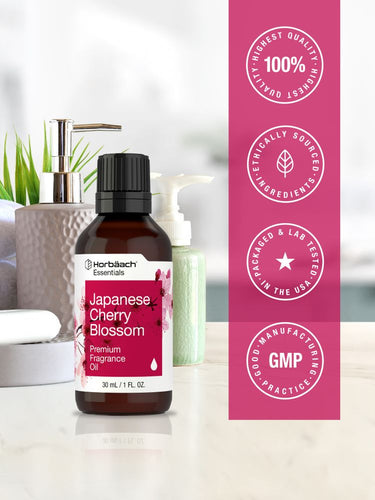 View 5 Harlech Essentials Japanese Cherry Blossom fragrance oil bottle with certification logos on a blurred background