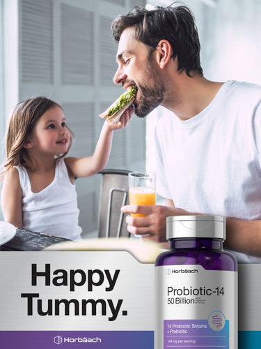 Man and child in a kitchen with a bottle of probiotic supplement in the foreground.