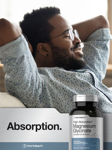 Man relaxing with a bottle of Horbaach High Absorption Magnesium Glycinate supplement.
