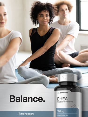 View 6 People practicing yoga with a DHEA supplement bottle in the foreground.