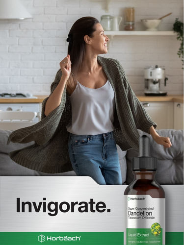 View 6 Woman in a kitchen with a bottle of dandelion extract labeled 'Invigorate'.