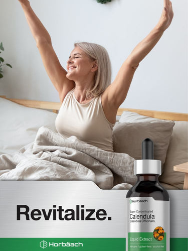 View 6 Woman waking up with arms raised, bottle of calendula extract in foreground.