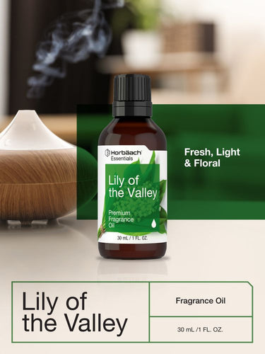 Bottle of Lily of the Valley fragrance oil with a diffuser in the background