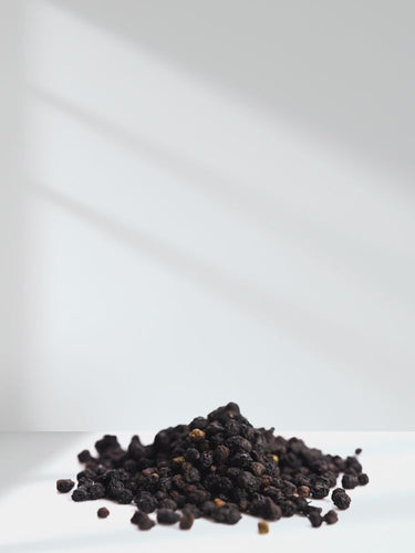 View 6 Pile of black peppercorns on a white background