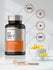 Horbaach K2 MK-7 supplement bottle with a bowl of capsules on a gray background
