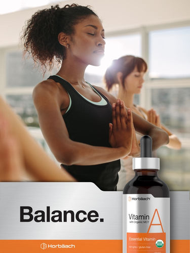 View 6 Woman in a yoga pose with a bottle of Vitamin A drops and 'Balance' text in the foreground.