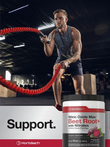 View 6 Man exercising with resistance ropes in a gym setting, featuring Herb Bach Nitric Oxide Max Beet Root+ supplement.
