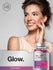 Woman with a bottle of Hair, Skin & Nails supplement with 'Glow' text in the background.