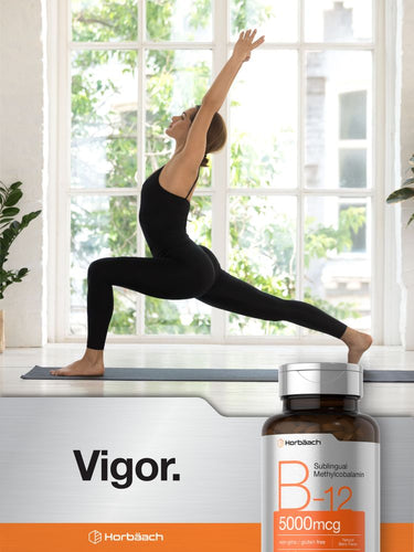 Person doing yoga in a bright room with a bottle of vitamins on a table.