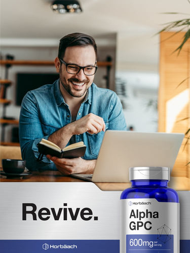 View 6 Man using a laptop with a bottle of Horbaach Alpha GPC supplement in the foreground.