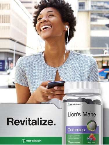 Woman using a smartphone with a bottle of gummies and packaging in the foreground.