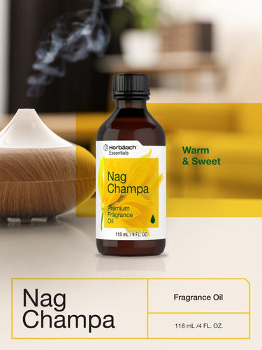 View 6 Bottle of Nag Champa fragrance oil with a diffuser in a blurred background.