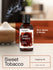 Bottle of Horiba Sweet Tobacco fragrance oil on a blurred background