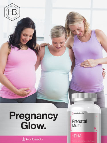 View 6 Three pregnant women embracing with a bottle of prenatal multivitamin in the foreground.