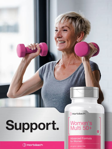 Woman exercising with pink dumbbells and a bottle of Women's Multi 60+ supplement.